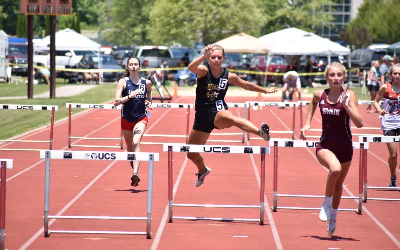 (Kevin Hensley • Graham Star) Emma Shook hurdles her way to a spot in the state championship event.