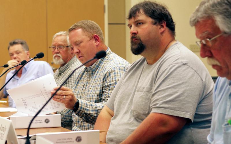 Jared Putnam • Clay County Progress From left, Clay County commissioners Scotty Penland, Clay Logan, Rob Peck, Randy Nichols and Dwight Penland listen as County Manager Debbie Mauney discusses the 2021-22 Clay County budget proposal on June 17 in Hayesville. The board of commissioners unanimously approved the $19.8 million budget.