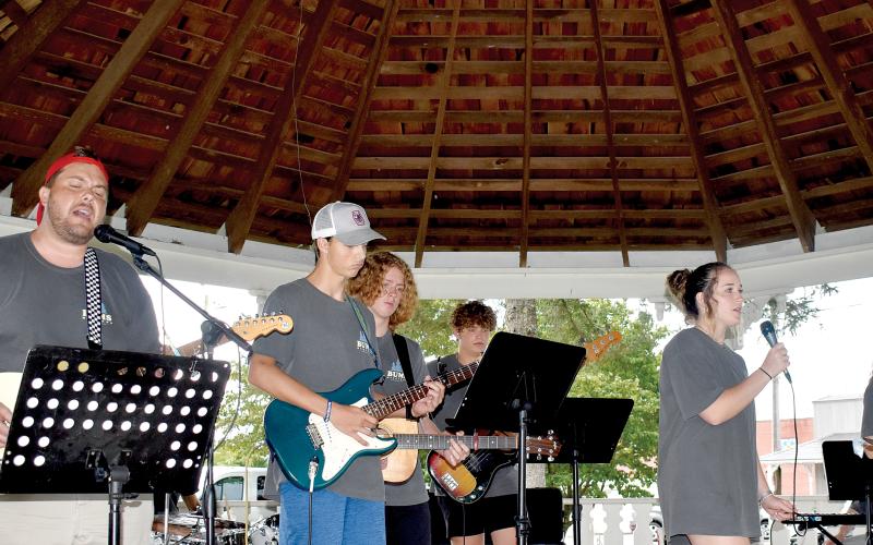 Members of the Bethel Baptist Praise Band fill the square with music and song with a special message.