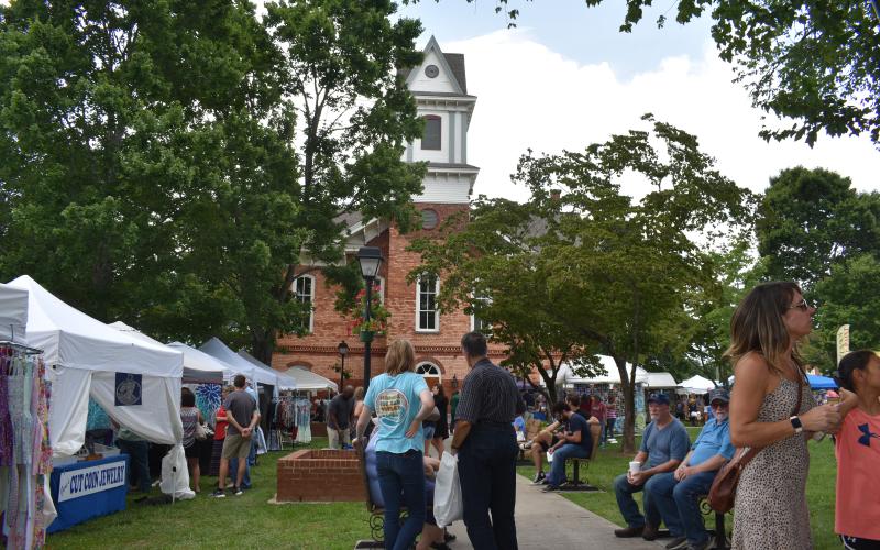 A large crowd enjoys the festive atmosphere on the square during the weekend celebration.