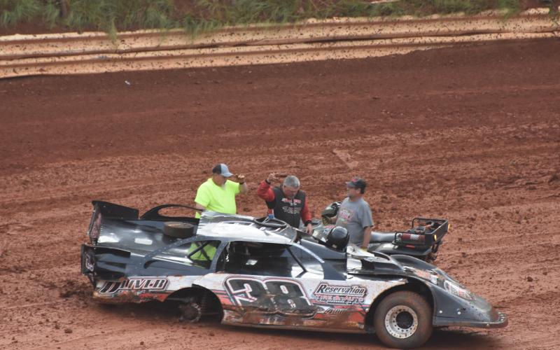 (Travis Dockery • Clay County Progress) Murphy native Jamie Oliver waves to the crowd after a scary rollover accident during hot laps.