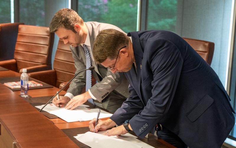 Georgia Department of Education Chief of Staff Matt Jones and TCSG Commissioner Greg Dozier sign articulation agreements that will allow students to receive TCSG college credits for certain Career, Technical, and Agricultural Education (CTAE) courses.
