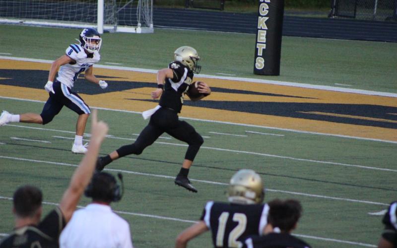 Photo by Brook Leatherwood Logan Caldwell puts points on the home side of the scoreboard with a quarterback keeper.