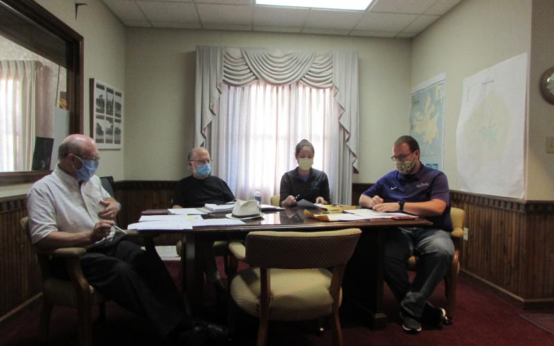 Lorraine Bennett • Clay County Progress Hayesville Mayor Harry Baughn (left) and Town Council members Joe Slaton, Lauren Tiger and Austin Hedden adhere to Covid-19 safety protocols by wearing masks throughout Monday’s meeting.