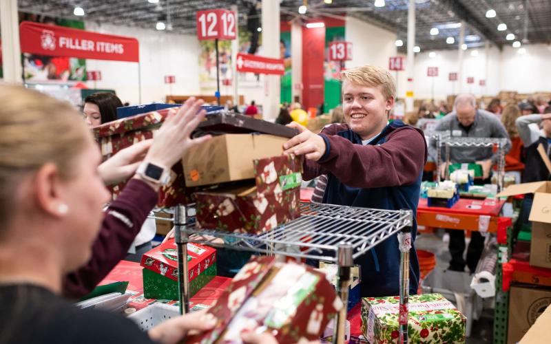 Volunteers packing boxes for Operation Christmas Child. (Photo from samaritanpurse.org)