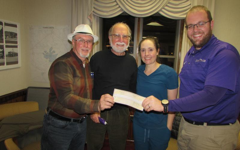 Mayor Harry Baugh, Councilman Joe Slaton, Councilwoman Lauren Tiger and Councilman Austin Hedden (L-R) are donating their financial “token of appreciation” checks to charity. The Town Council offered all citizens who can provide proof they are town residents and have been vaccinated against the Covid-19 virus a check for $100. As of Monday, 107 checks had been issued.