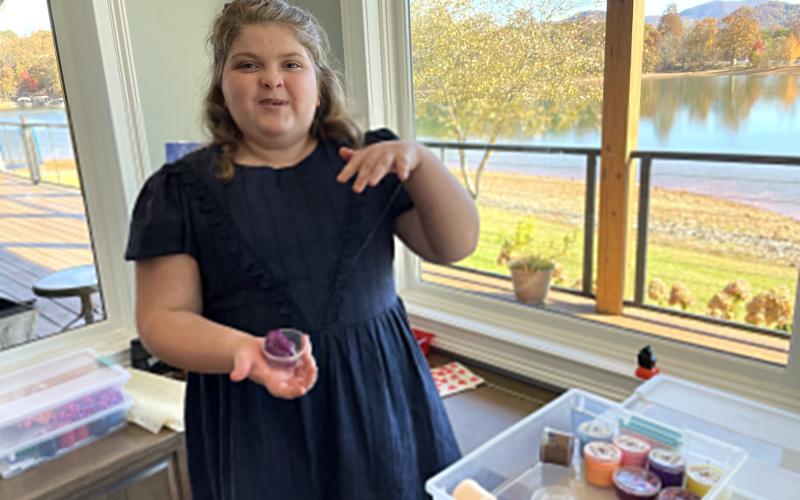 Marie Lance shows off her collection of toy "slime" at the home of her grandmother, Anita Lance. (Photo by Jared Putnam)