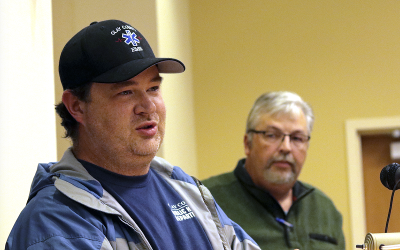 (Jared Putnam / Clay County Progress) Clay County Community Paramedic Ben English speaks while fellow paramedic Jeff Ledford looks on during the Clay County Board of Commissioners meeting on Nov.4 in Hayesville.
