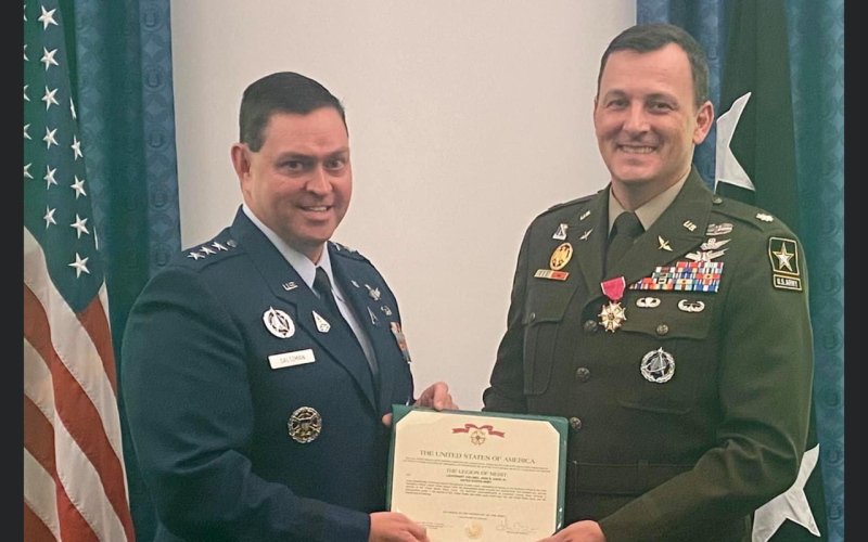 Lt. Col John Brian Davis, right, is honored as for his years of service.