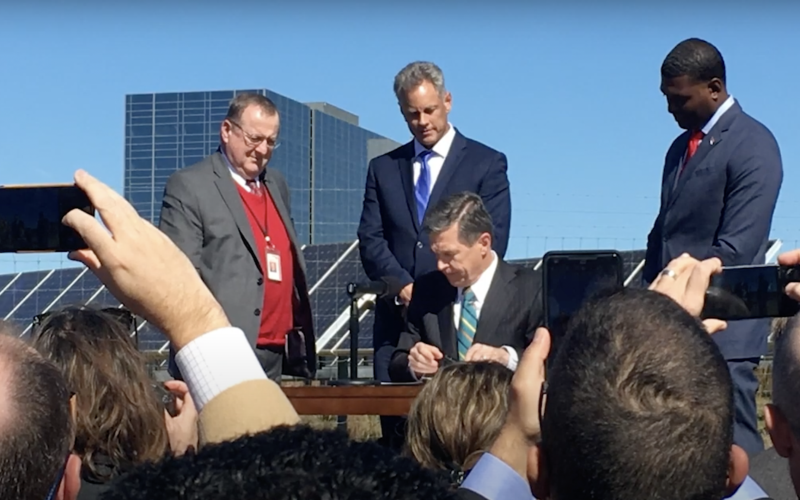 Gov. Roy Cooper signing Executive Order 80 in 2018 that, among other directives, required the N.C. Department of Transportation to develop a ZEV Plan for the state. (Photo from ncdot.gov.)