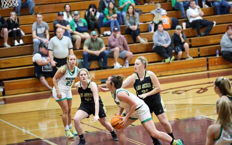 Kelli Graves • Clay County Progress Brooke Graves. No. 40 and Kaylee Leatherwood, No.31, focus on defense against Mtn. Heritage.