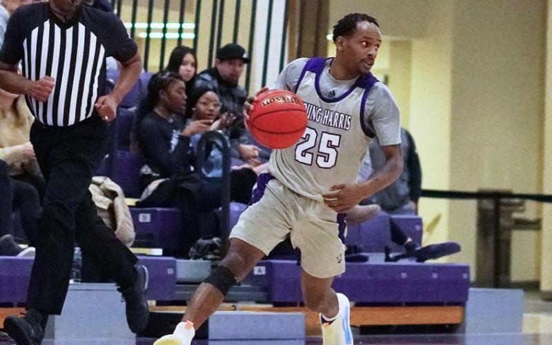 Lenny Pradia controls the floor looking for a game-changing play. (Photo by Steve Miller /YHC Athletics)