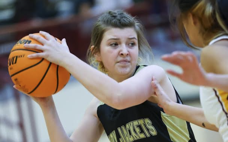 Kelli Graves • Clay County Progress Maple Mackey fights off Cherokee defense looking for an open.