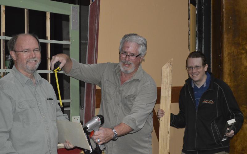 (Pam Roman •  Submitted) Set builders, from left, Jim Oliver, Stan Rasmussen and Sean Rice enjoy socializing while constructing the latest set at the Peacock Performing Arts Center.