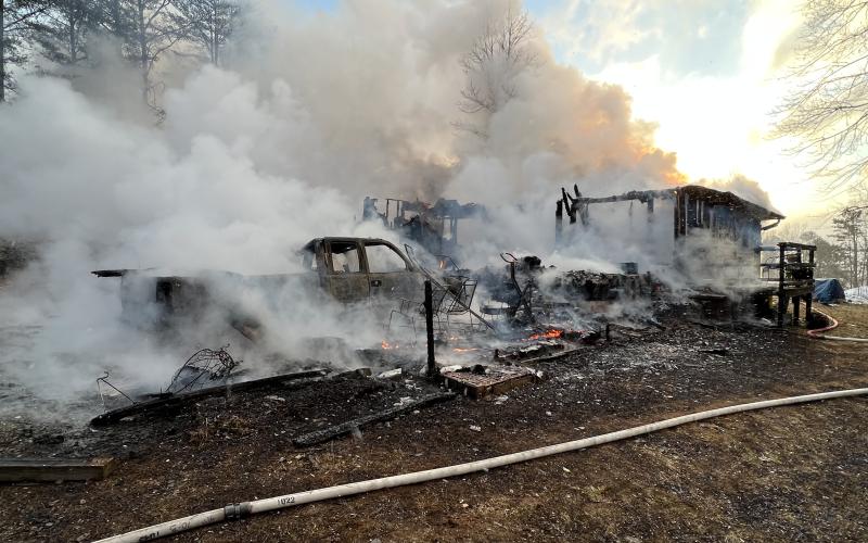 (Photo courtesy of Clay County Fire and Rescue) When members of Clay County Fire and Rescue responded to this house fire in the Town Mountain community, it was fully engulfed leaving behind mostly charred debris.