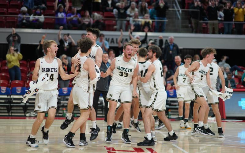 (Photo by Kelli Graves) The Hayesville Yellow Jackets celebrate their 1A state championship as the clock hits all zeros.