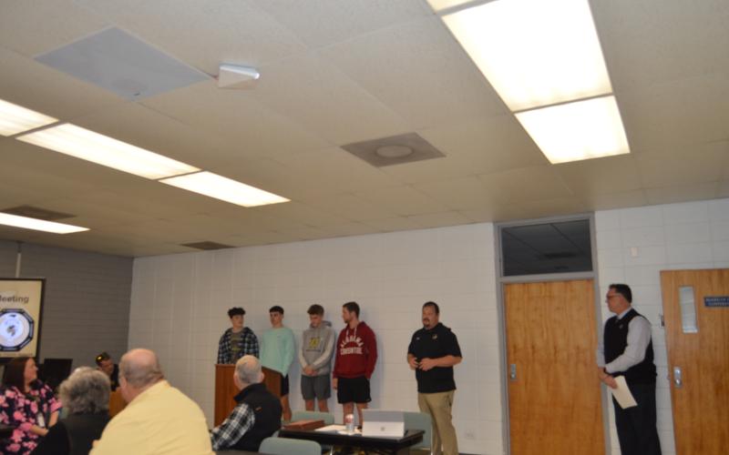 Marcia Barnes • Clay County Progress Taylor McClure, Logan Caldwell, Ethan Hooper, Kyle Lunsford were recognized at the school board meeting for their athletic achievements by Coach Chad McClure.