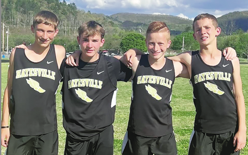 Setting new school record in the 4x800, from left, Jackson Dye, Hayden Hunt, Noah Carter and Micah Moss.