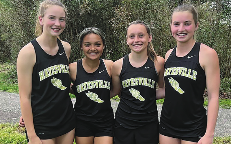 Olivia Giddens, Kadence Morrow, Emma Ashe and Ava Shook set a school record with 1:55.50 in 200 relay.