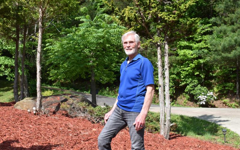 Marcia Barnes  • Clay County Progress Dwight Moss pauses for a moment in a garden area he planted at his home in Clay County.