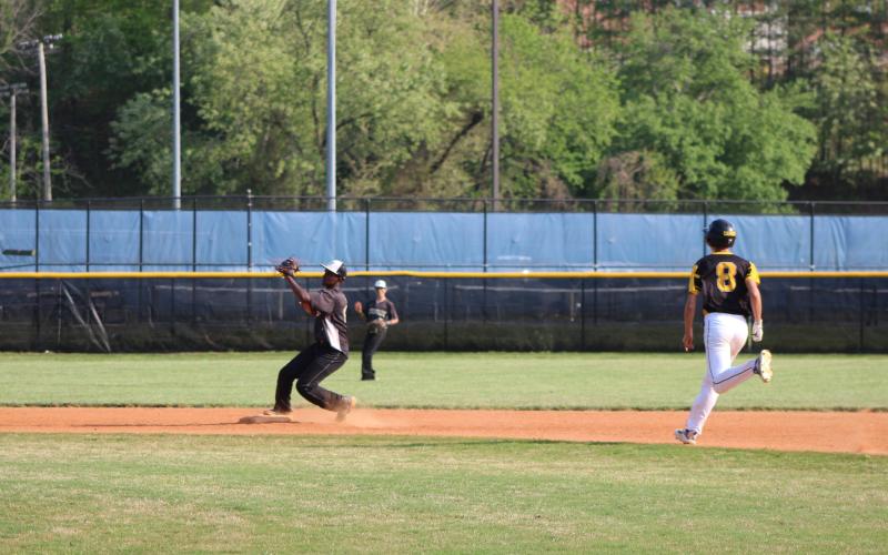Rebecca Hall• Clay County Progress Middle school Jacket Will Brown catches the ball to turn a double play.