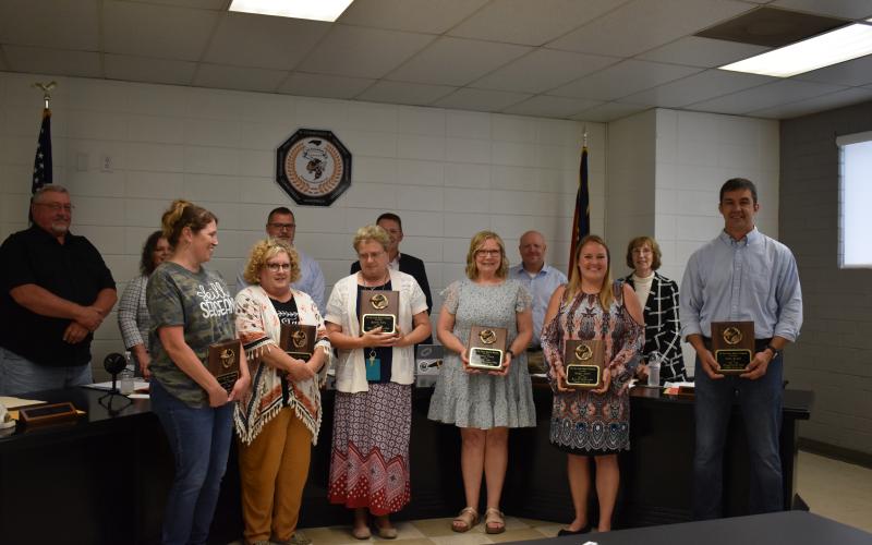Marcia Barnes  • Clay County Progress Teachers of the Year  were recognized by the Clay County Board of Education at the May 23, 2022 board meeting. They are, front, from left, Courtenay Sumpter, Teresa Ashe, Bonnie Kelly, Sharon Perry, Ginger Scerri and Silas Brown. Back, from left, school board members’ Danny Jones, Kelly Crawford, Jason Shook, Superintendent Dale Cole, Robert Caldwell and Reba Beck congratulate the teachers.