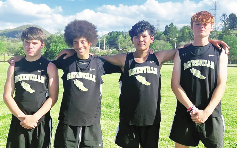 Setting a new school record in the 4x100, from left, Tre Graves, Jack Dorsey, Raul Rivera-Prieto and Peyton McGaha.