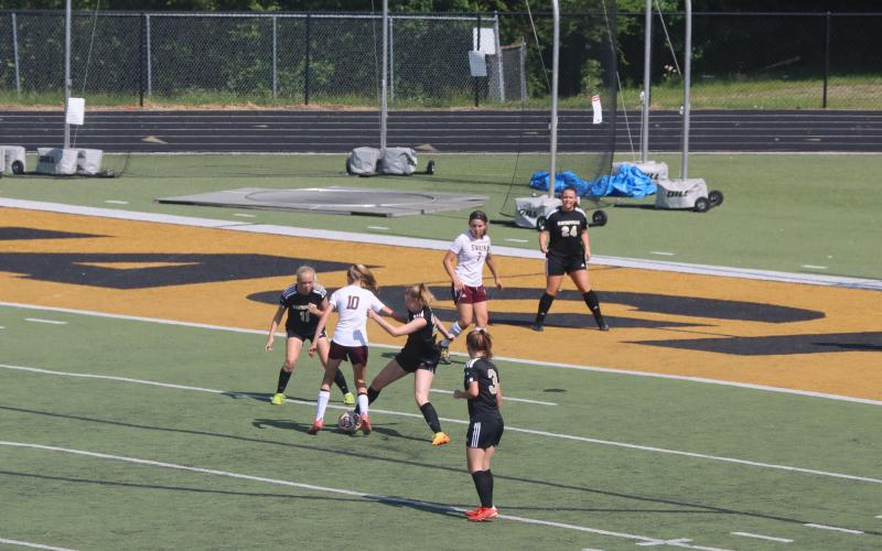 Deby Jo Ferguson • Clay County Progress Cecilia Jones and Trinity Frias team up to steal ball from opponent.