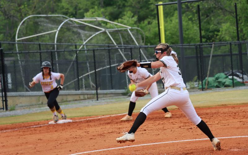 Addie Bunch throws a great pitch as a Lady Bulldog attempts a steal to home.