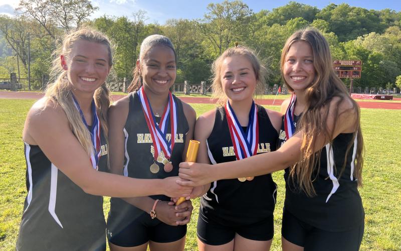 The 4x400 and 4x800 Meter Relay Team are from left, Emma Shook, Marley Espinal, Lila Roberts and Alyssa Rodd.
