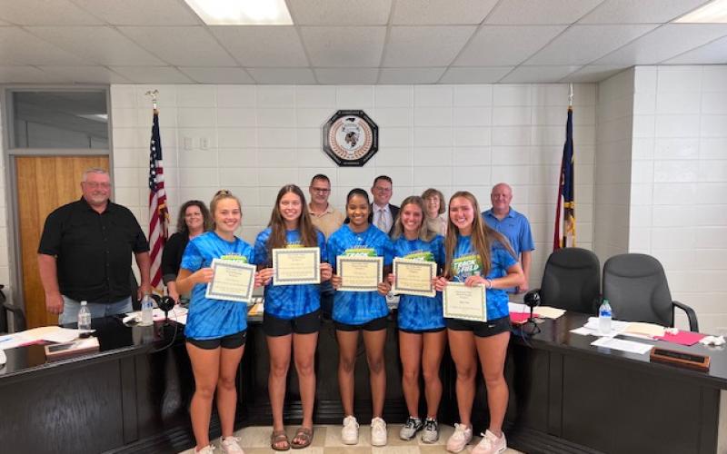 Ladies Field and Track Team awards were presented at the June 27 Clay County School Board of Education meeting, front, from left, Emma Shook, Lily Trout, Marley Espinal, Alyssa Rodd and Lila Roberts, back Danny Jones, Kelly Crawford, Jason Shook, Dale Cole, Reba Beck and Robert Caldwell.