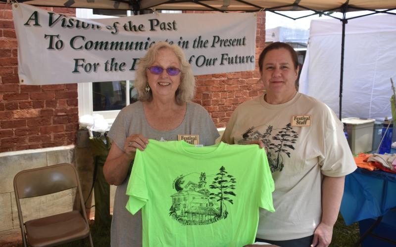 Historical and Arts Council sells T-shirts at the booth.