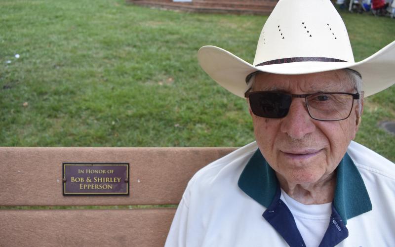 Bob Epperson relaxes on the courthouse square bench named in his and wife Shirley's honor.