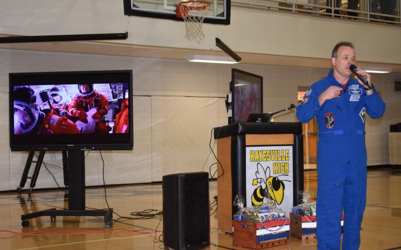 Lorrie Ross • Clay County Progress Former NASA astronaut shared slides of his experiences as he spoke to Hayesville students on Friday, Sept. 9. This slide shows him in a rocket with fellow astronauts.