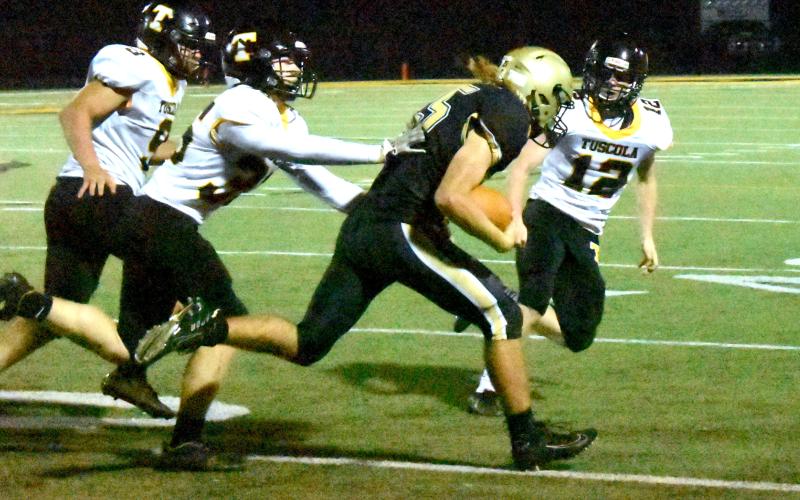 Gary Corsair • Clay County Progress Bryan Davenport, No. 25, turns on the afterburners on a kick return against Tuscola.