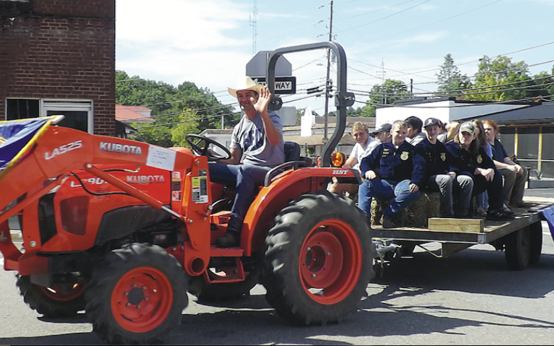 Becky Long • Clay County ProgressHayesville High School Future Farmers of America members participate in the Clay County Tractor Parade on Saturday, Sept. 24 on a tractor operated by Silas Brown. Members created a hay maze, obstacle course and entered a float. A highlight of the event was the raffle for a 1948 Ford 8N that had been restored by George Kresage of Murphy. The lucky winner was Florida resident, Maitland Dampier. Proceeds from the event go to the Dwight Smith Scholarship Fund. About 28 tractors
