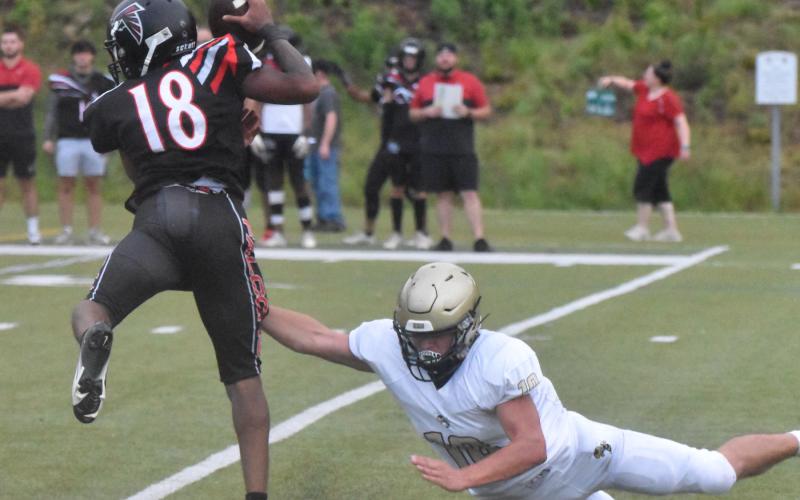 Gary Corsair • Clay County Progress Yellow Jacket Avery Leatherwood, No. 10, hangs on to North Georgia’s quarterback after chasing him out of the pocket.