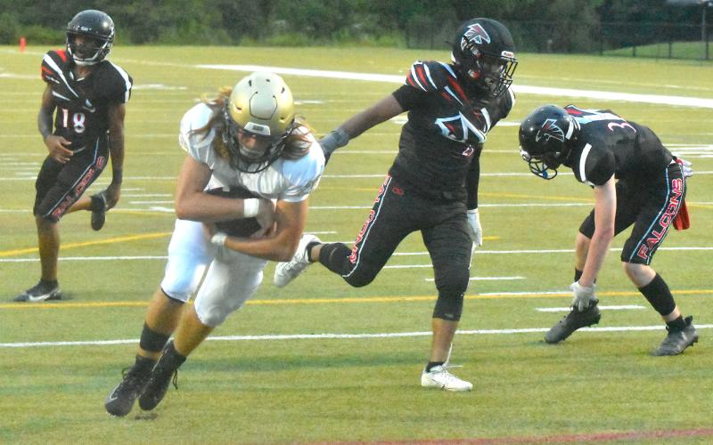 Gary Corsair • Clay County Progress Hayesville's Bryan Davenport, No. 25, lunges into the end zone for an 8-yard touchdown after befuddling three North Georgia defenders on a pass from Logan Caldwell.