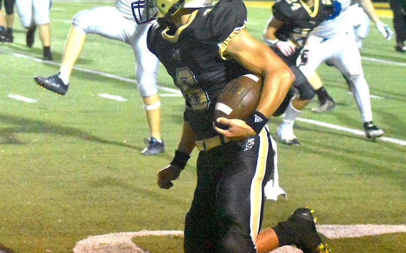 Logan Caldwell, No. 6, sprints around the end for a big gain.