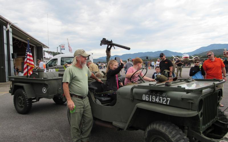 Photo by Linda Hagberg Children seemed to enjoy the military vehicles that were scattered around hanger A as part of the display during Saturday's Welcome Home event.