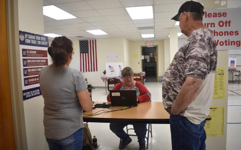 Deby Jo Ferguson • Clay County Progress Election Board worker Benita England mans the registration desk during Friday’s early one-stop voting at the Board of Elections office in Hayesville where voting has been steady.