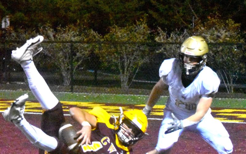 Gary Corsair• Clay Progress Cherokee’s Kaden Smith, No. 12, falls into the end zone after intercepting a pass intended for Taylor McClure, No. 20, with :29.5 remaining. A Hayesville touchdown would have cut Cherokee’s lead to 28-27 and given the Yellow Jackets a tie in the game with a point-after kick to take the lead with