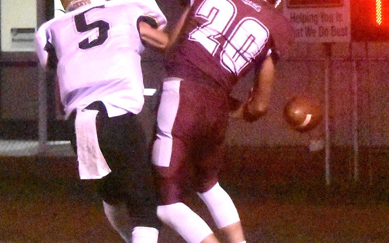 Gary Corsair • Clay County Progress Hayesville's Tate Roberts, No. 5, is all over Swain's Dawson Fuller, No. 20, like white on rice as he frustrates the Red Devil efforts to catch a pass in the end zone.