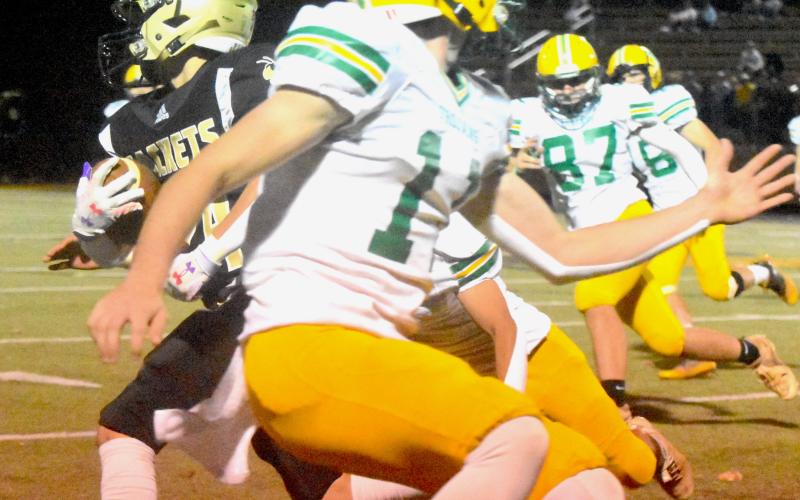 Gary Corsair • Clay County Progress  Hayesville’s “Mighty Mite” Michael Mauney, No. 24, explodes past defenders on a 24-yard kickoff return.