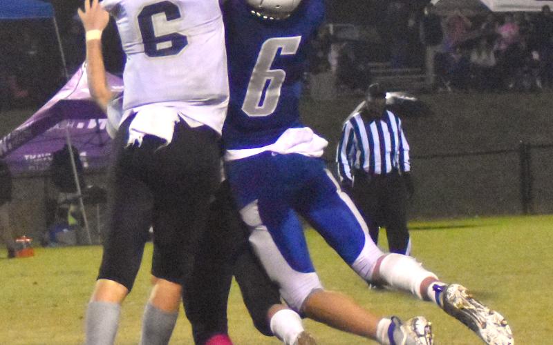 Gary Corsair • Clay County Progress Hayesville defenders Michael Mauney and Logan Caldwell, No. 6, break up a pass to Christ The King receiver Jake Dulski.