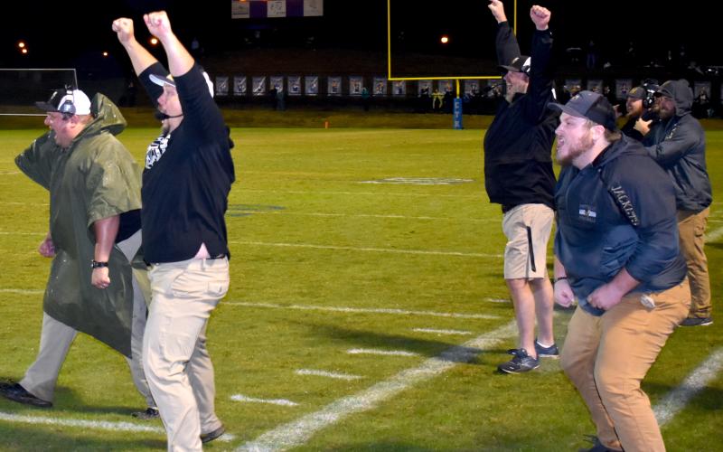 Gary Corsair • Clay County Progress From left, Kenneth Dockery, Chad McClure, Jon Hensley, and Logan Thurmond. Barrett Woody and Zach White in way back. rejoice as Taylor McClure blocks a field goal attempt to preserve the Yellow Jackets 14-13 second-round playoff victory over Christ The King.