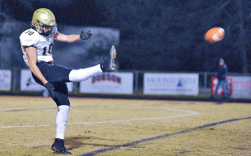 Zach Colburn • The Mount Airy News Punter extraordinaire Avery Leatherwood, No. 10, gets all of the ball on one of two Hayesville punts that went for more than 50 yards.