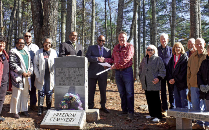 Becky Long • Clay County Progress Gathering for the deed presentation from Rural Development Authority to Ft. Hembree Baptist Church on Friday are, from left, Ann Miller Woodford of One Dozen Who Care, Annie Lloyd, Kent Dorsey, Betty Dorsey, Rev. Tony Barr, Ft. Hembree Pastor Hal Holbrook, County Commission and RDA member Scotty Penland, Betty Bradley, Rob Tiger, Reba Beck, Commissioner Clay Logan, and property neighbors George and Carol Gaines. The Gaines said the cemetery is part of the reason they were a