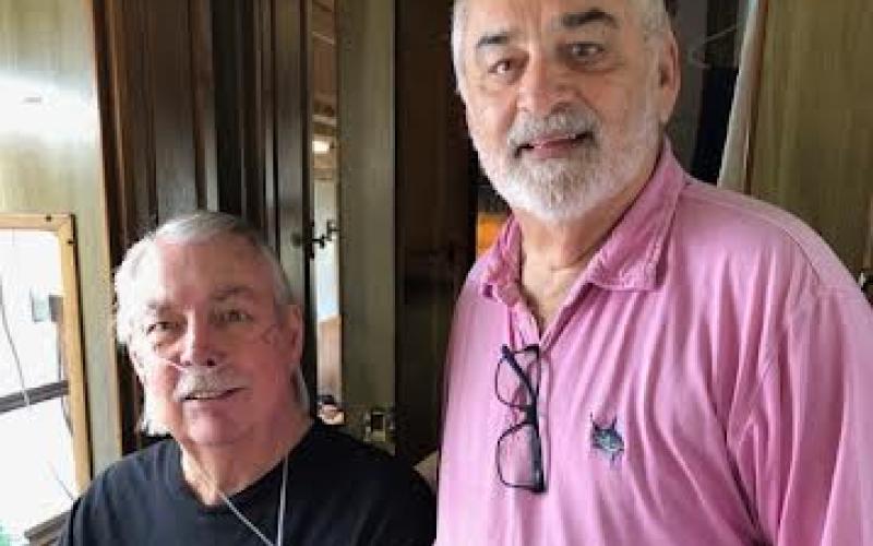 Jane Hart • Photo From left, Bill Curns led an active and productive life but now battles several illnesses and disabilities. He’s getting assistance from Hearts in Ministry volunteer Larry Capps.