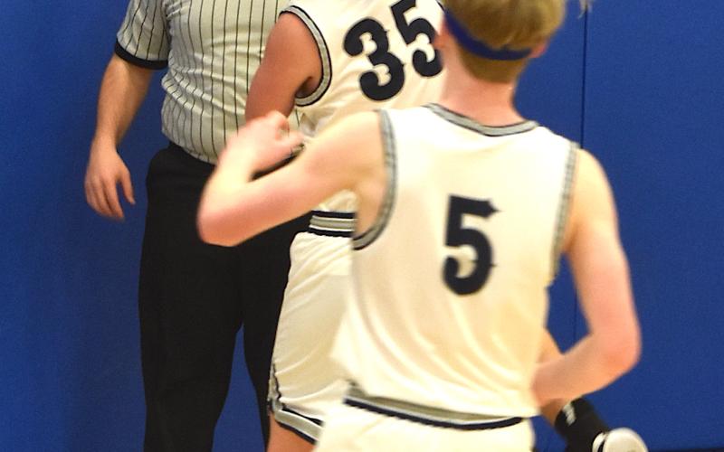 Gary Corsair • Clay County Progress Hayesville's super sixth man Isaac Chandler goes up strong for 2 of his 9 points after grabbing one of his 7 rebounds in the Yellow Jackets 87-33 waxing of Nantahala.